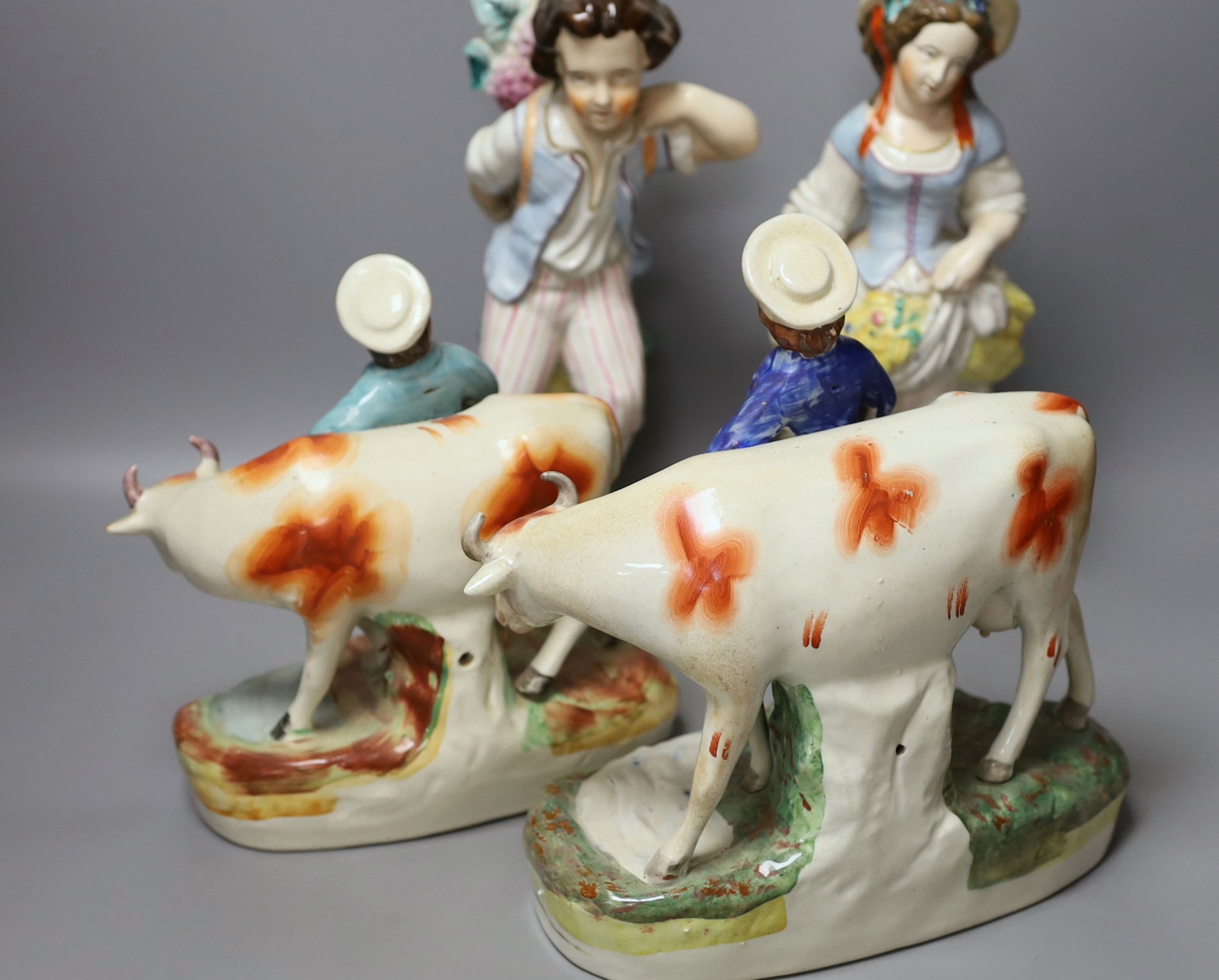 Assorted Staffordshire figures and a 'peck o' malt' jug - tallest 29cm